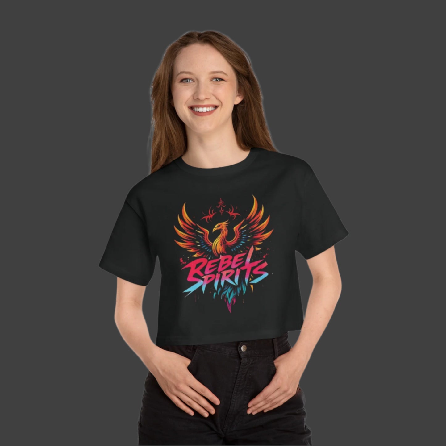 Person wearing a black t-shirt with a colorful phoenix design and 'Rebel Spirits' text on a white background