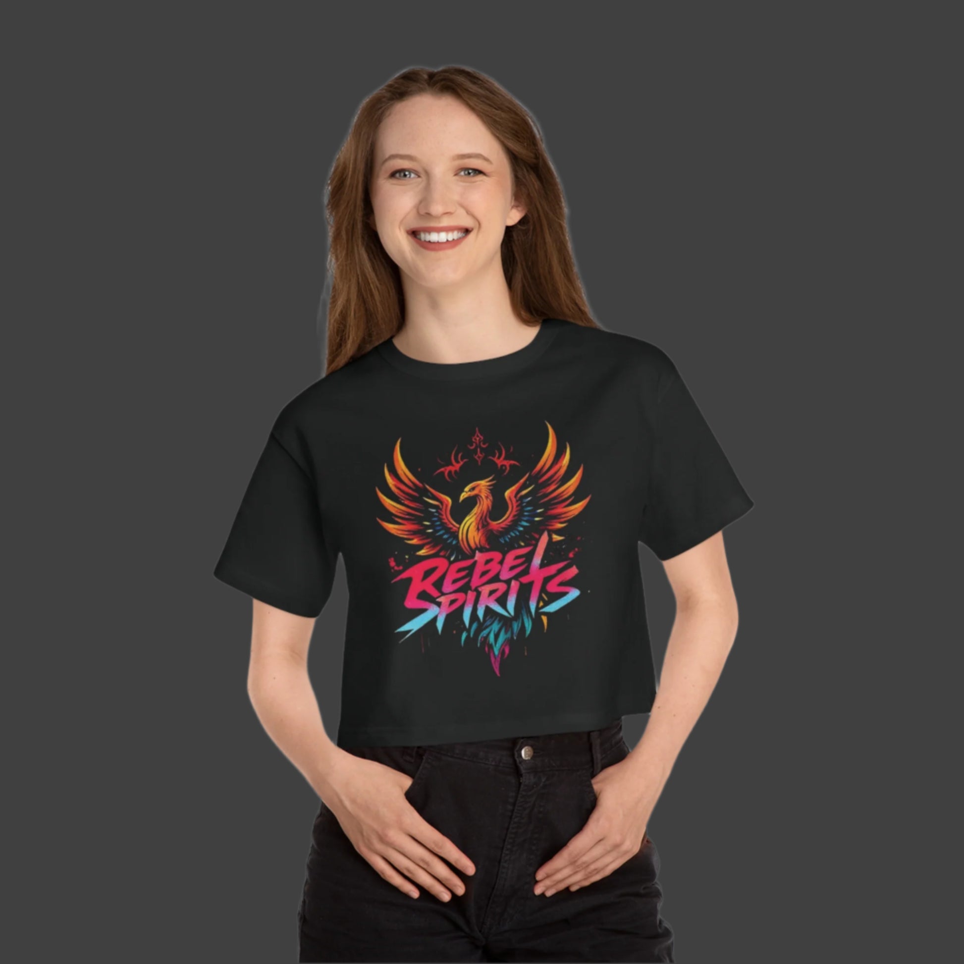 Person wearing a black t-shirt with a colorful phoenix design and 'Rebel Spirits' text on a white background